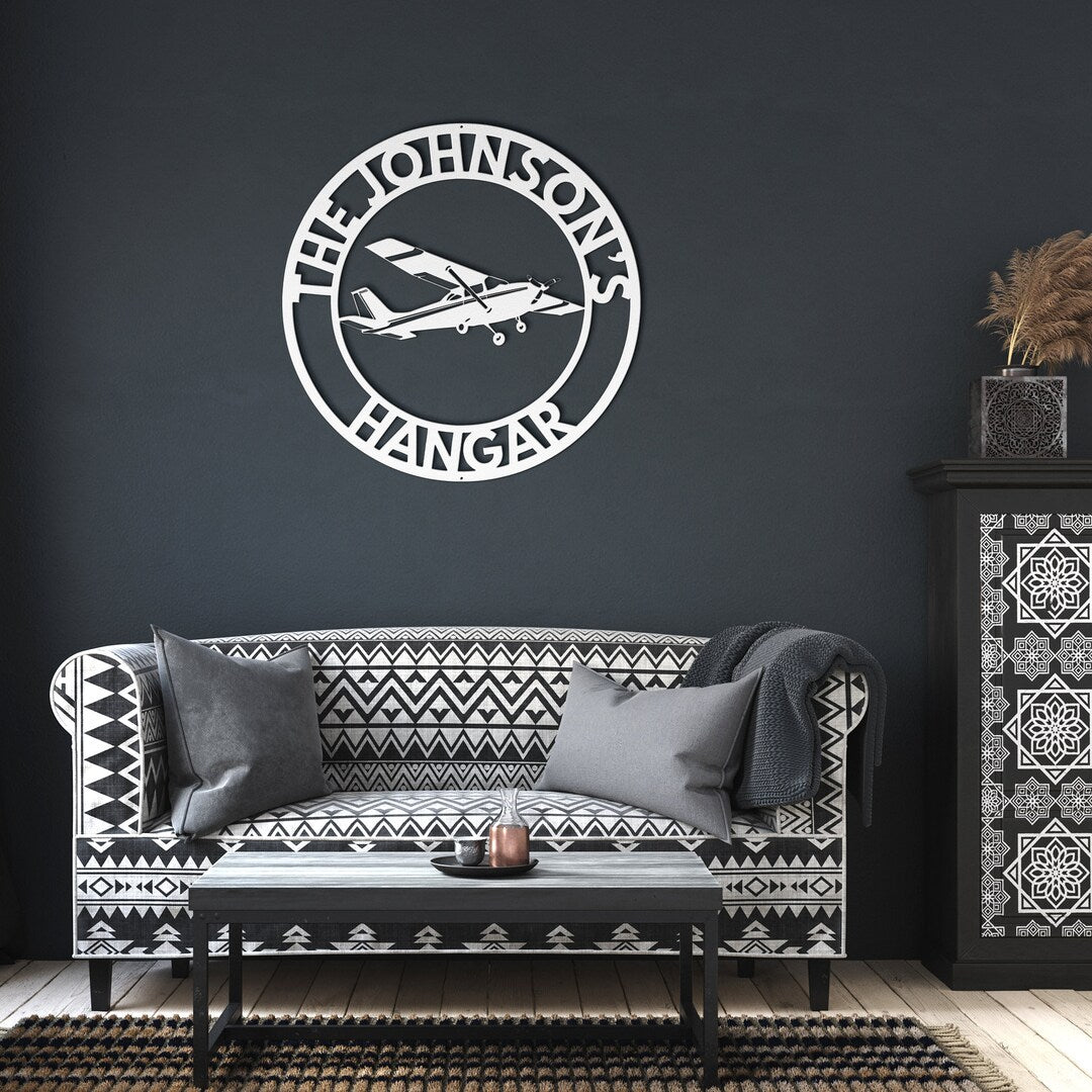 White Cessna hangar sign above sofa