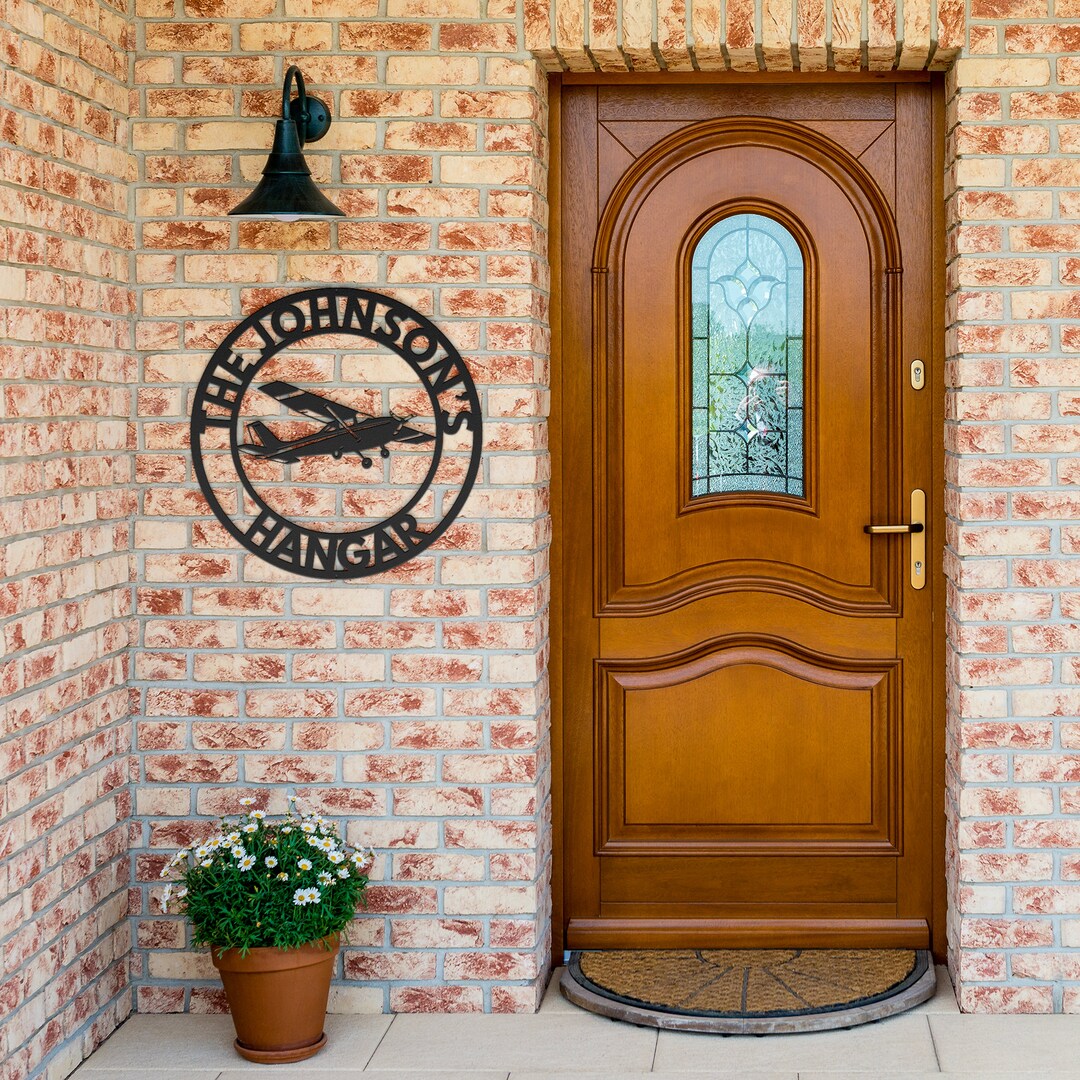 Cessna hangar sign mounted by door
