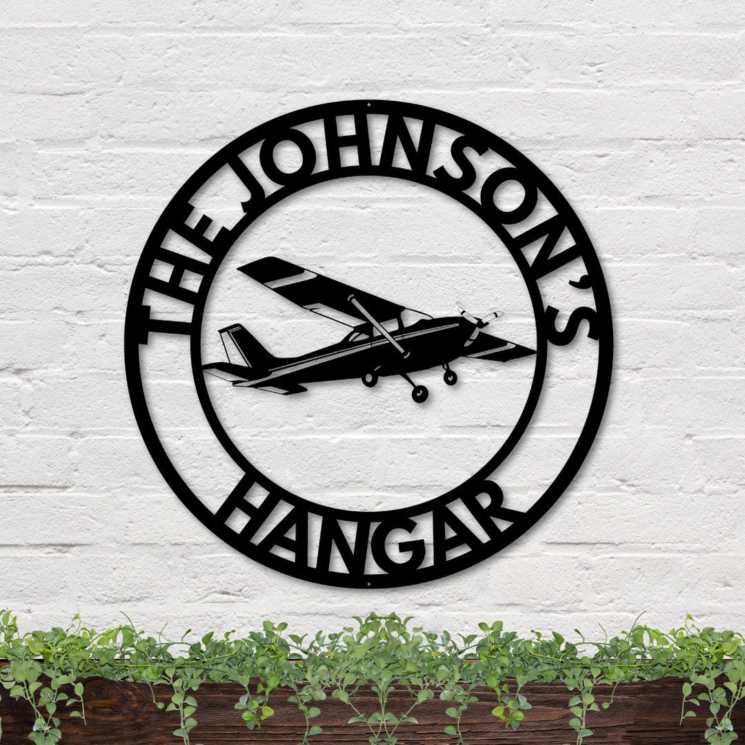 Cessna airplane hangar sign, black, circular design
